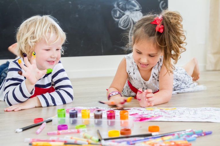 children painting using their fingers