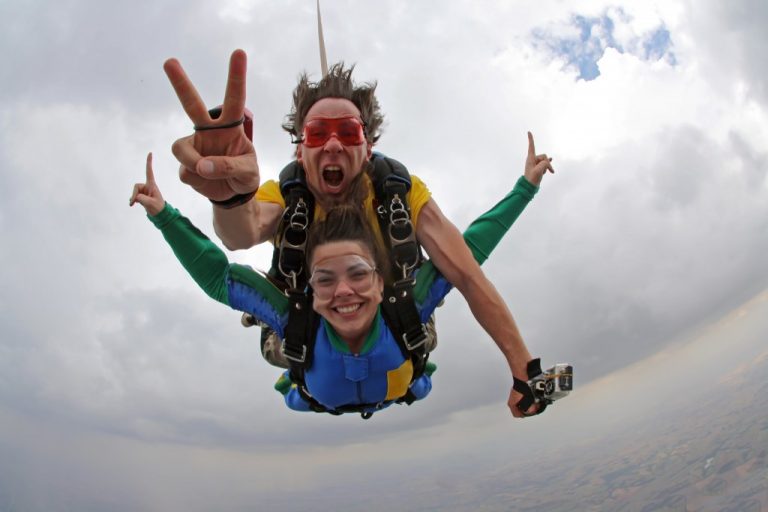 man and woman skydiving