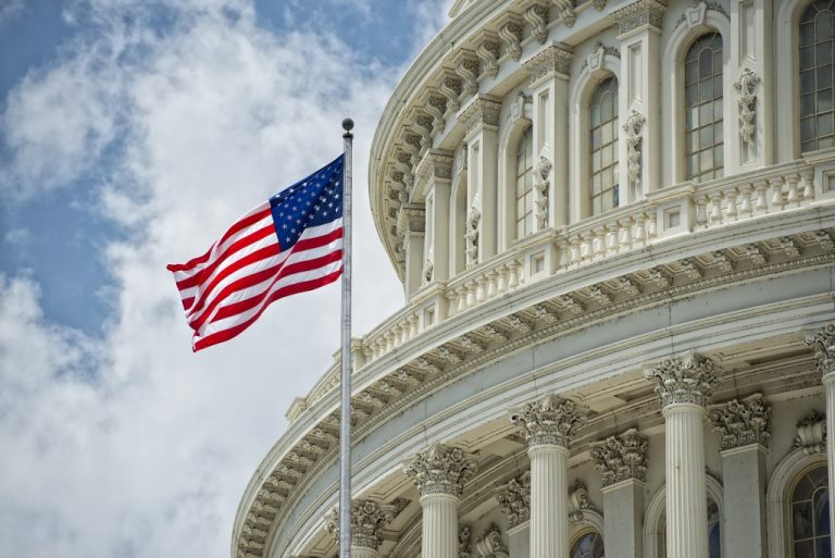 american flag near the capitol