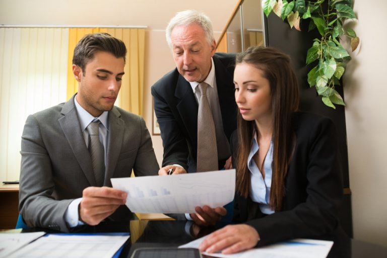 management reading a document