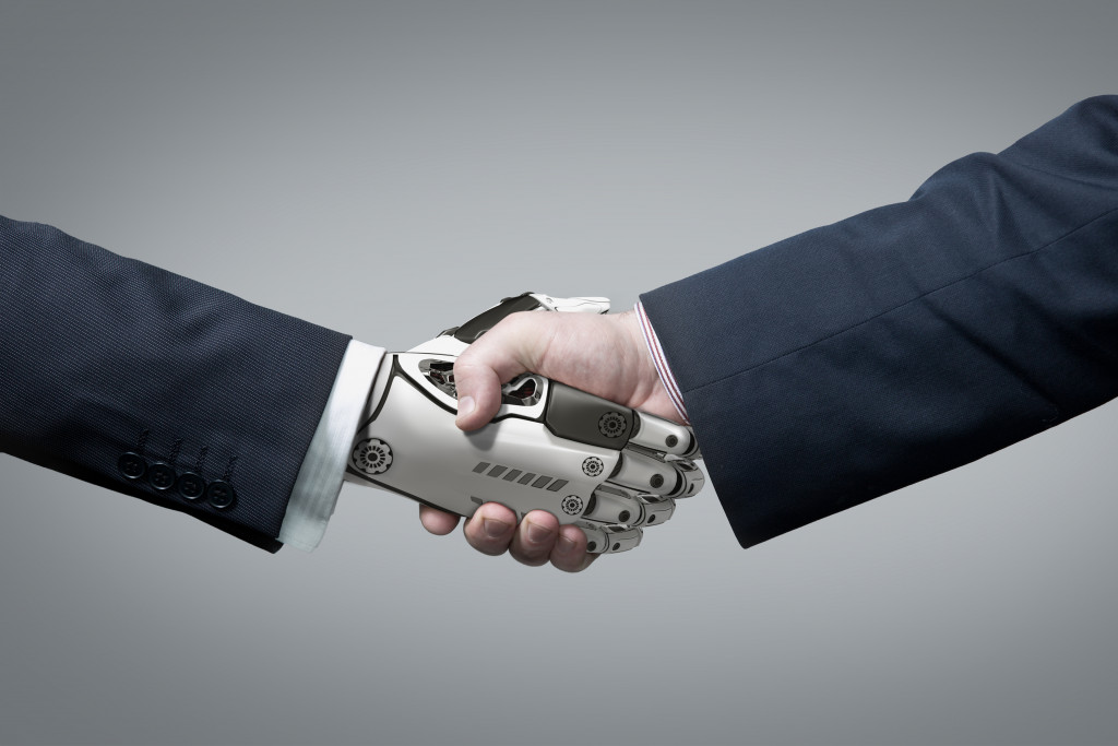 businessman and robot hand